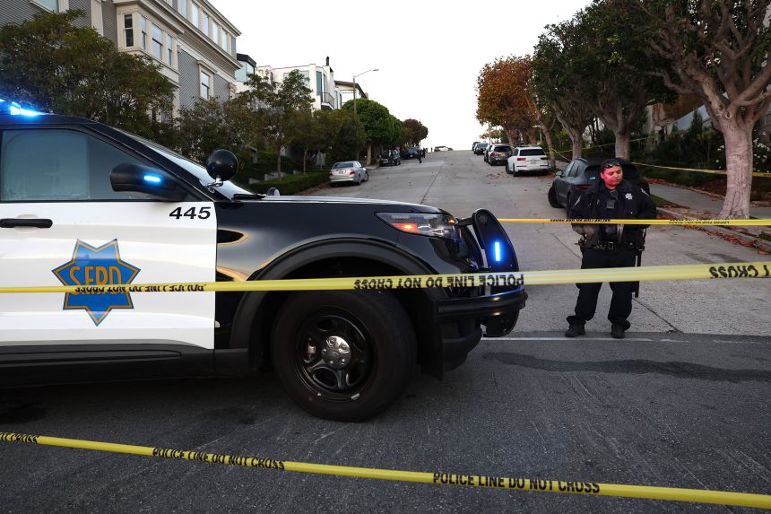 A San Francisco police officer stands guard in front of the home of then-Speaker of the House Nancy Pelosi on October 28, 2022, after her husband Paul Pelosi was attacked by an intruder.